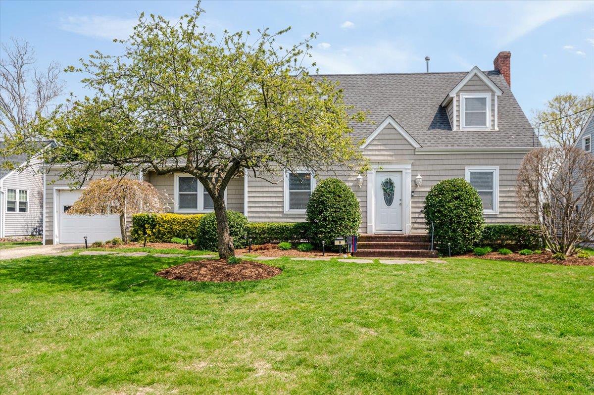 9 Walnut Avenue Patchogue, NY 11772 - Photo 1 of 1 front view of a house with a yard