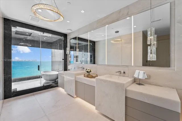 a bathroom with a bathtub and shower