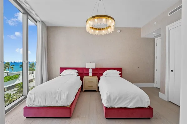 a bathroom with a double vanity sink toilet and shower