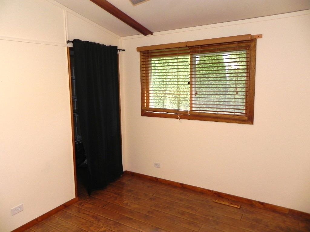 980 Winborne Road Lake Summerset, IL 61019 - Photo 28 of 58 an empty room with wooden floor and a window