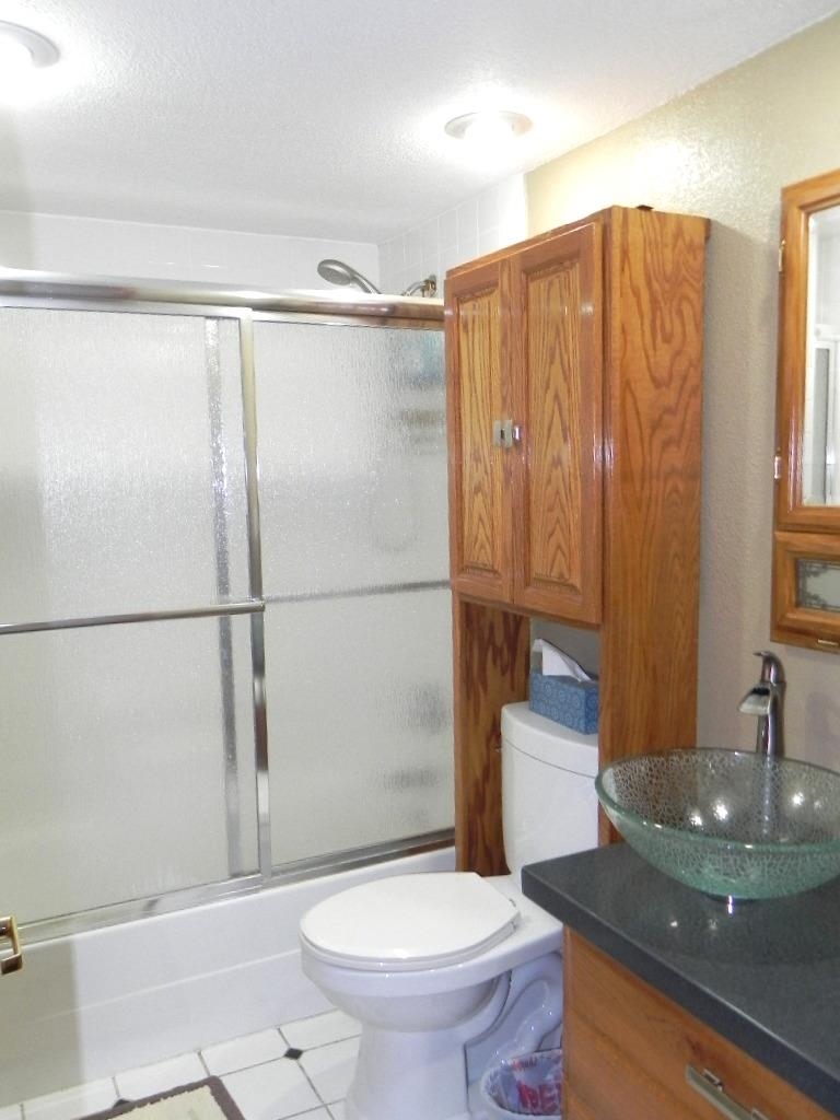 980 Winborne Road Lake Summerset, IL 61019 - Photo 29 of 58 a bathroom with a sink toilet and shower