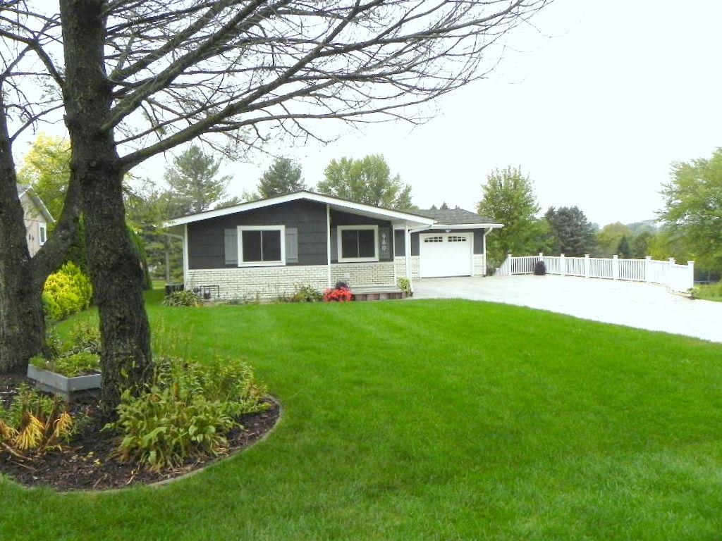 980 Winborne Road Lake Summerset, IL 61019 - Photo 3 of 58 a front view of a house with a yard