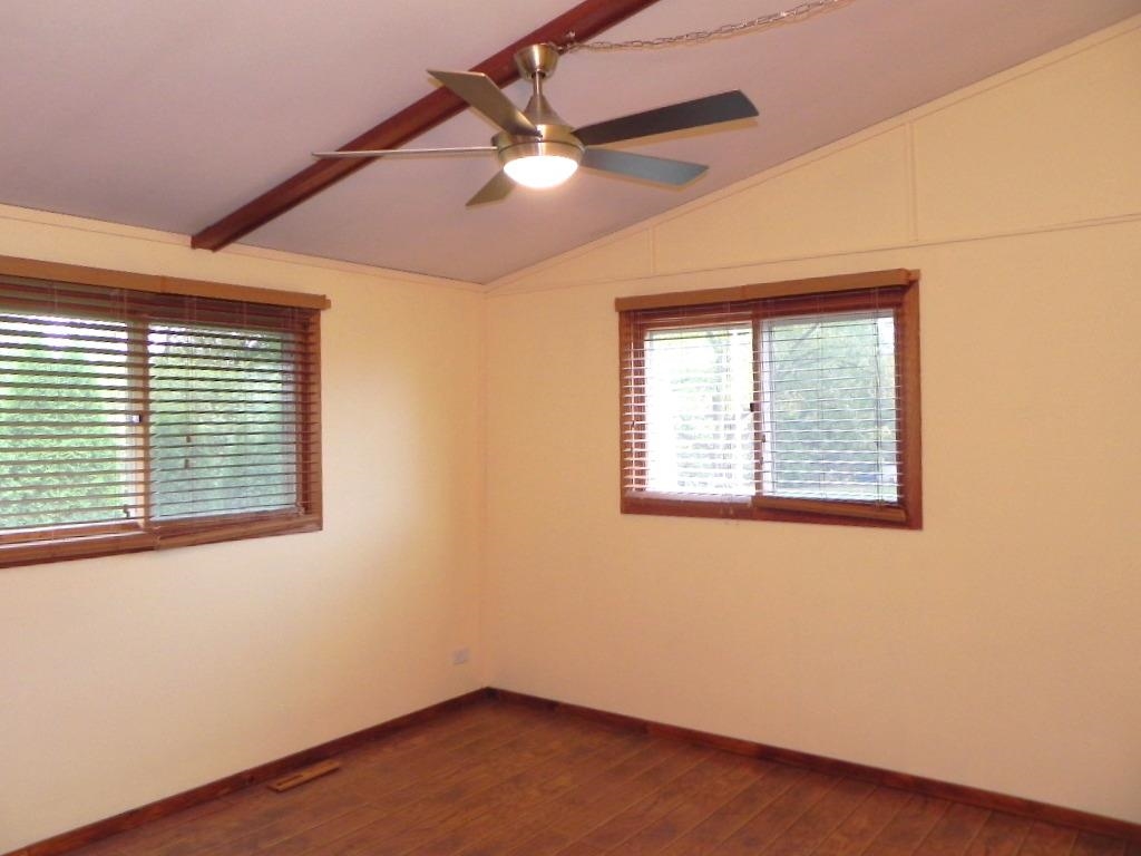 980 Winborne Road Lake Summerset, IL 61019 - Photo 34 of 58 an empty room with a window and a ceiling fan