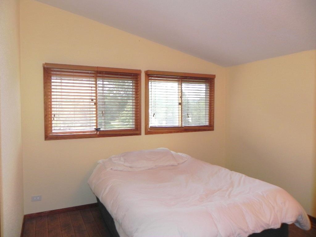 980 Winborne Road Lake Summerset, IL 61019 - Photo 36 of 58 a bed sitting in a bedroom next to a window