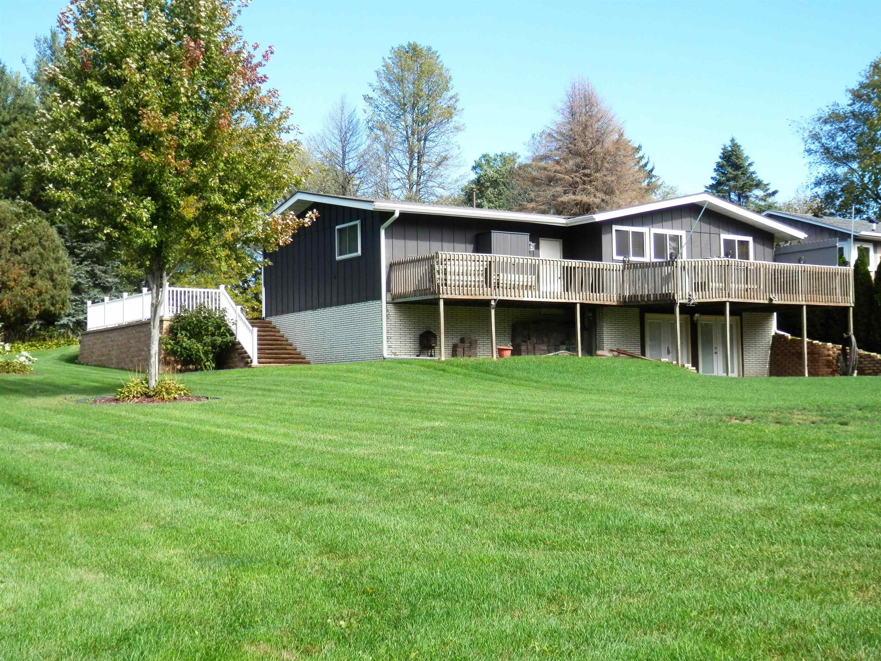 980 Winborne Road Lake Summerset, IL 61019 - Photo 6 of 58 a view of a big yard with large trees and a big yard