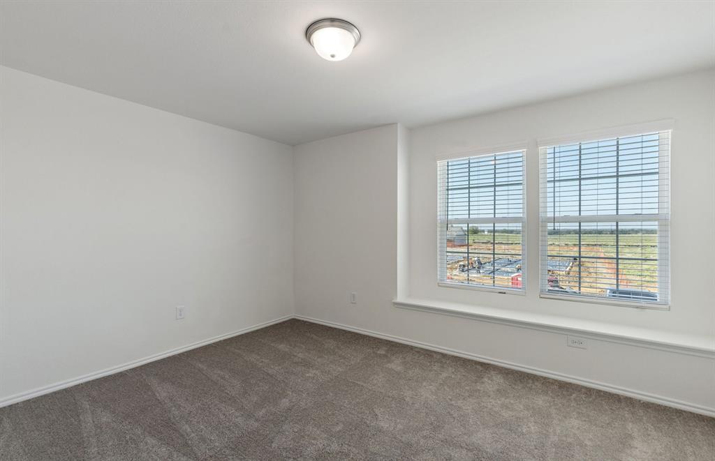 828 Springwell Drive Princeton, TX 75407 - Photo 15 of 17 *Floorplan representation, not actual home - Spacious secondary bedroom with large windows