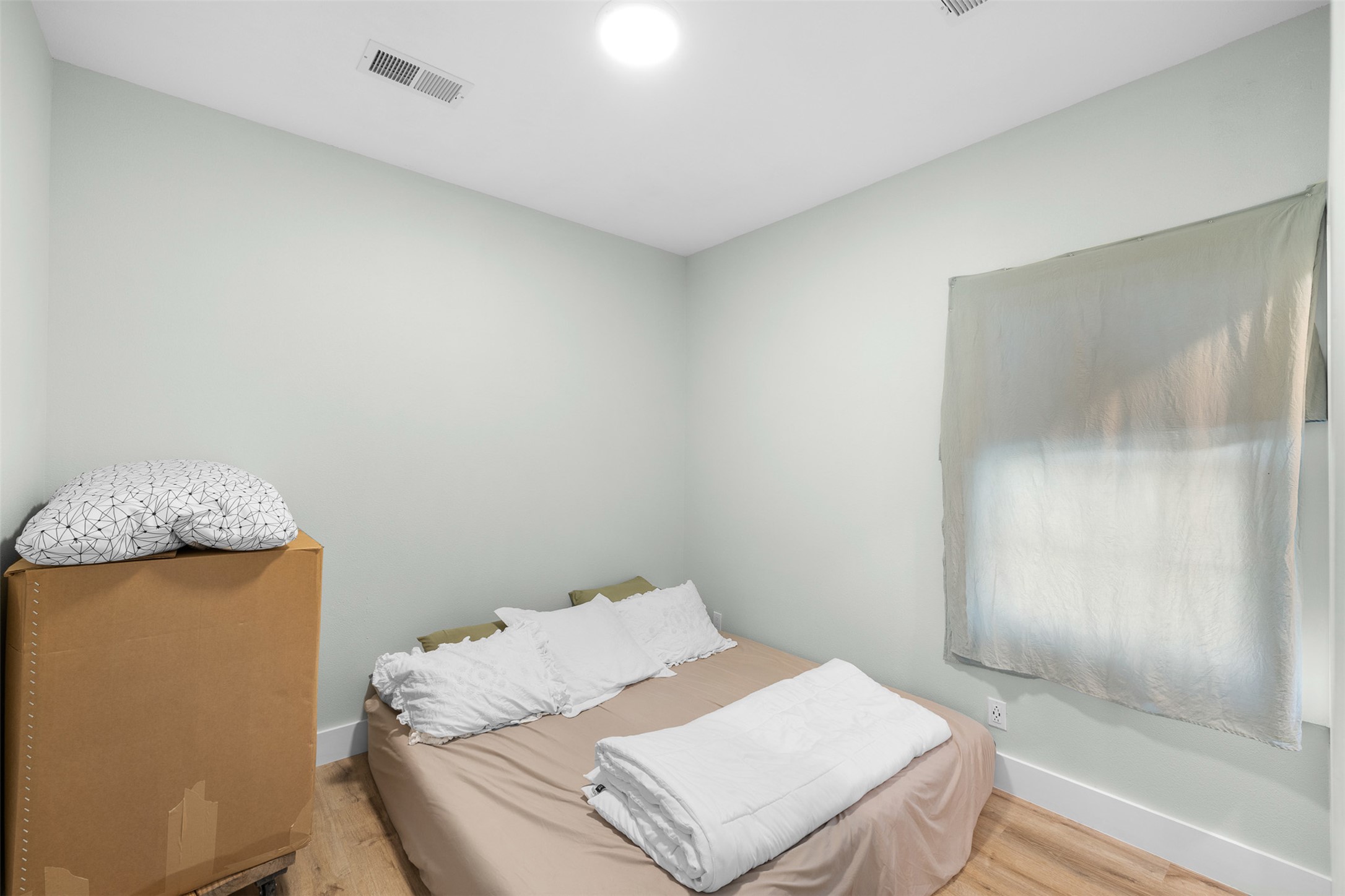 1759 Gotier Trace Road Paige, TX 78659 - Photo 18 of 40 a bed sitting in a bedroom next to a bathroom