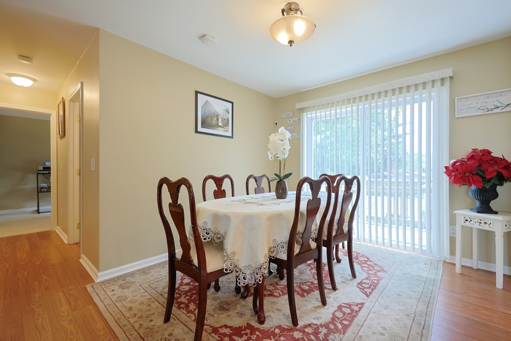 4 Colonial Road Webster, MA 01570 - Photo 11 of 38 a view of a dining room with furniture and wooden floor