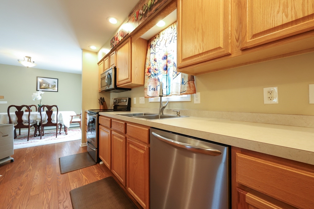 4 Colonial Road Webster, MA 01570 - Photo 15 of 38 a kitchen with stainless steel appliances granite countertop a sink and cabinets