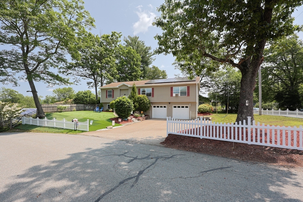 4 Colonial Road Webster, MA 01570 - Photo 2 of 38 a view of a house with a yard and fence