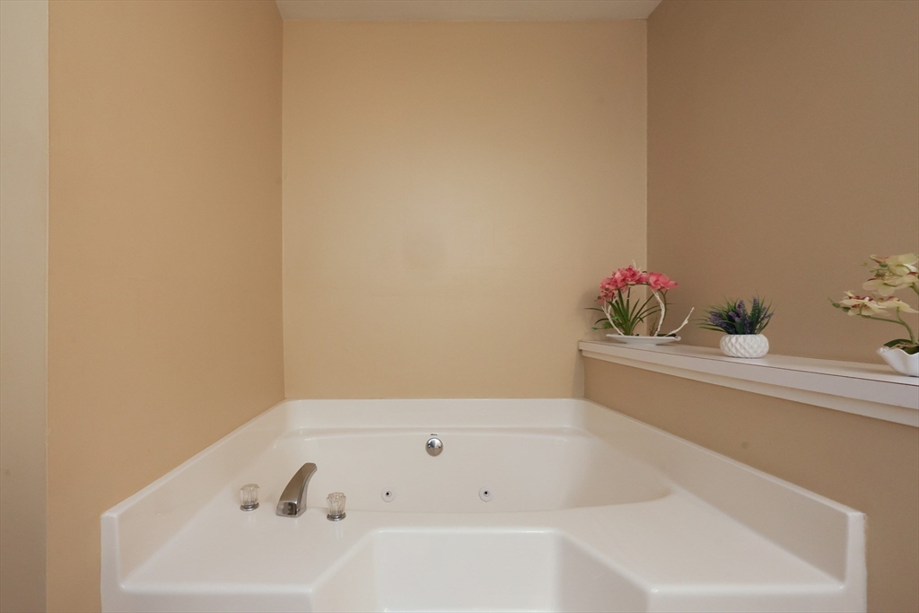 4 Colonial Road Webster, MA 01570 - Photo 23 of 38 a bathroom with a tub