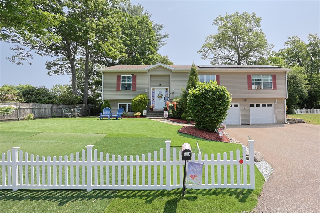 4 Colonial Road Webster, MA 01570 - Photo 37 of 38 a front view of a house with garden
