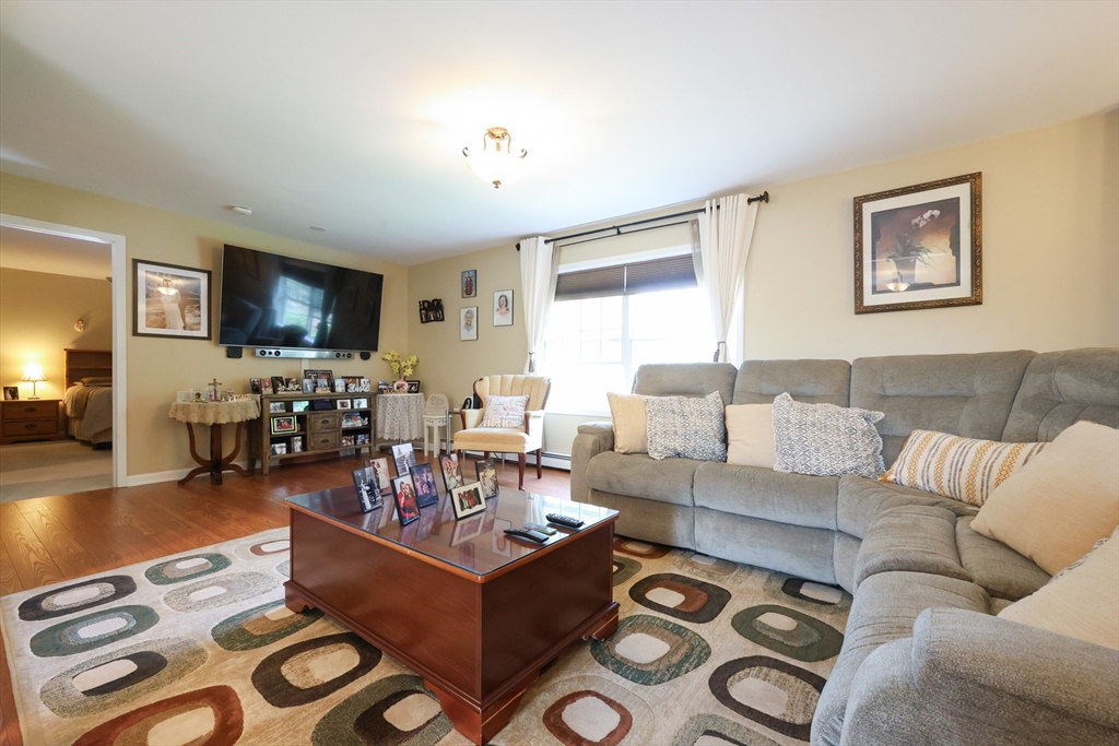 4 Colonial Road Webster, MA 01570 - Photo 5 of 38 a living room with furniture and a flat screen tv
