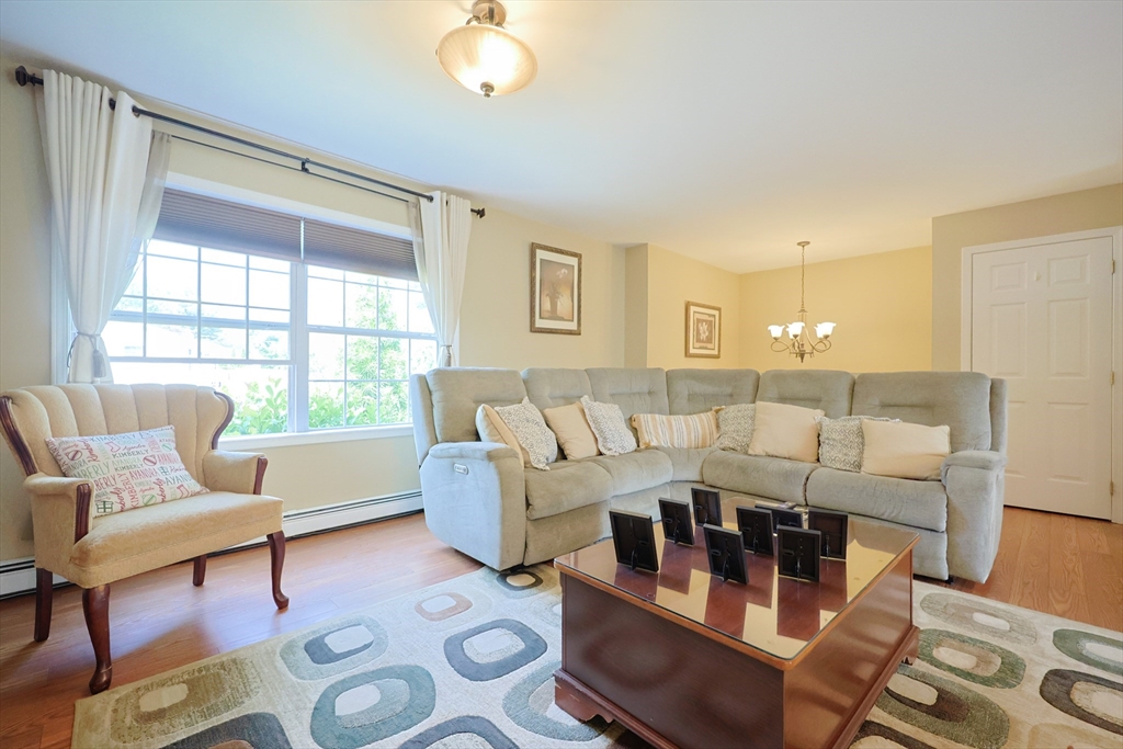 4 Colonial Road Webster, MA 01570 - Photo 6 of 38 a living room with furniture and a large window