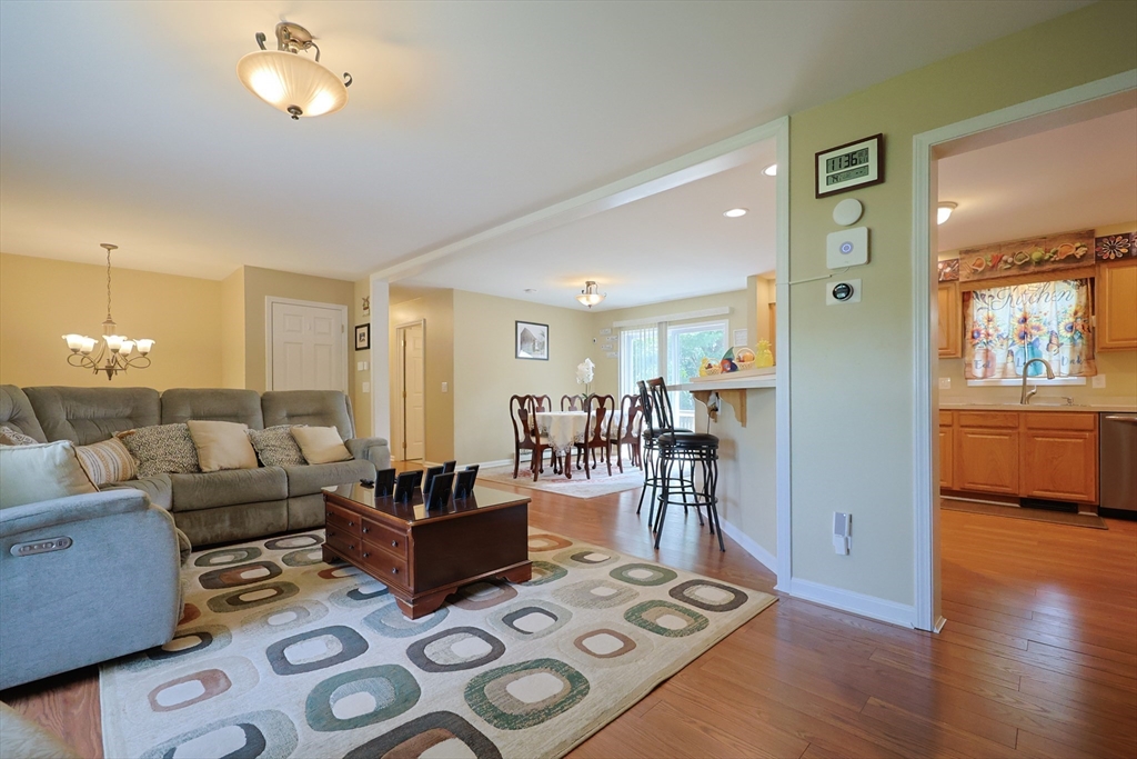 4 Colonial Road Webster, MA 01570 - Photo 9 of 38 a living room with furniture and a table