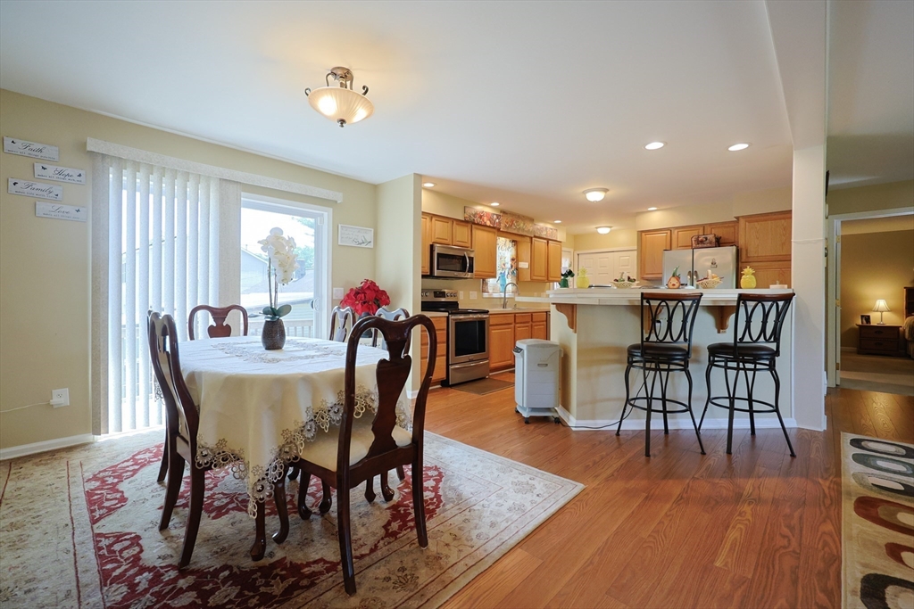 4 Colonial Road Webster, MA 01570 - Photo 10 of 38 a view of a dining room with furniture and wooden floor