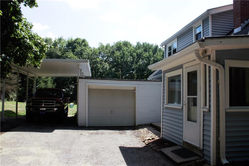 350 West Sunbury Road Butler, PA 16001 - Photo 3 of 25 Door to the mudroom. Detached garage with covered car port.