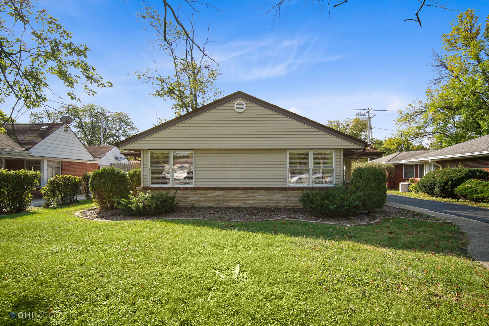1217 183rd Street Homewood, IL 60430 - Photo 2 of 19 a front view of house with yard and green space