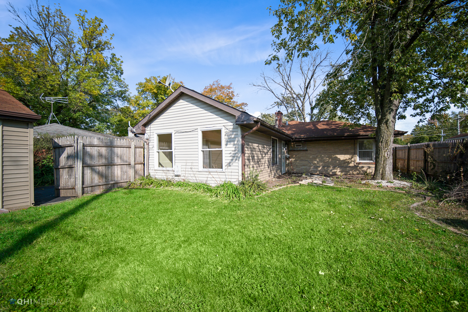 1217 183rd Street Homewood, IL 60430 - Photo 18 of 19 a view of a backyard with a large tree