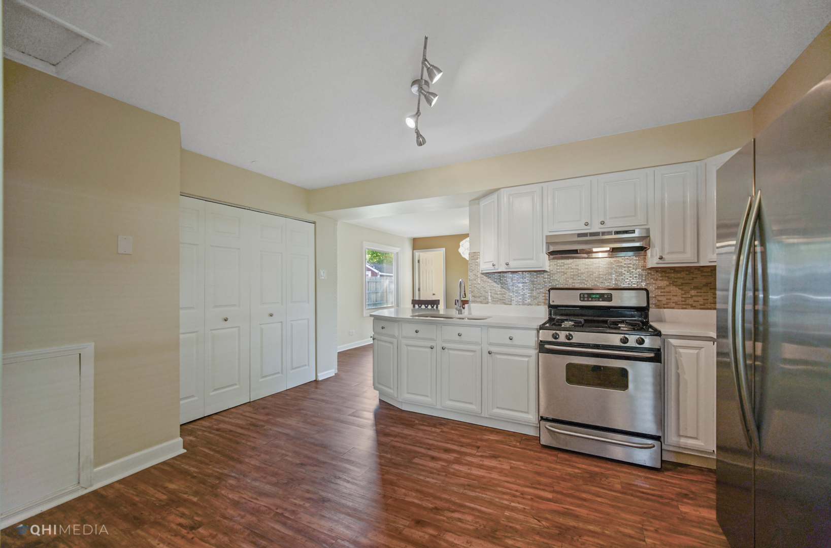 1217 183rd Street Homewood, IL 60430 - Photo 5 of 19 a kitchen with a refrigerator stove and wooden floor