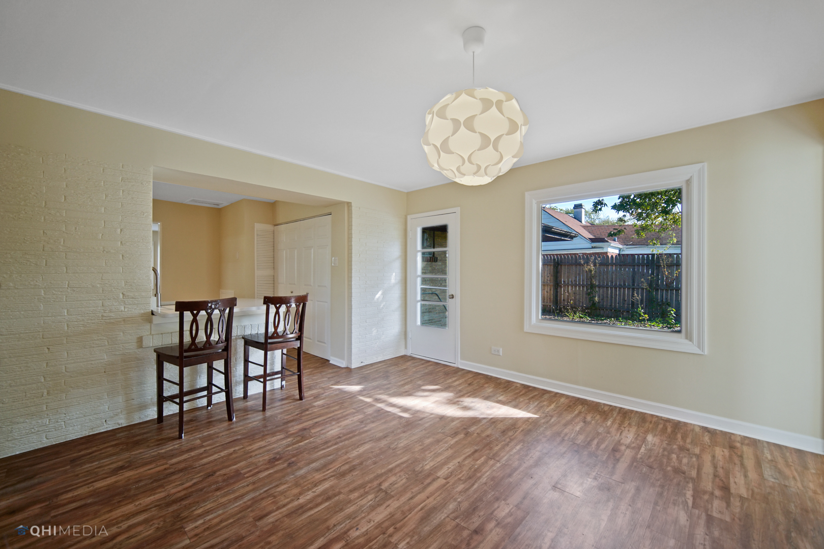 1217 183rd Street Homewood, IL 60430 - Photo 8 of 19 an empty room with wooden floor and windows
