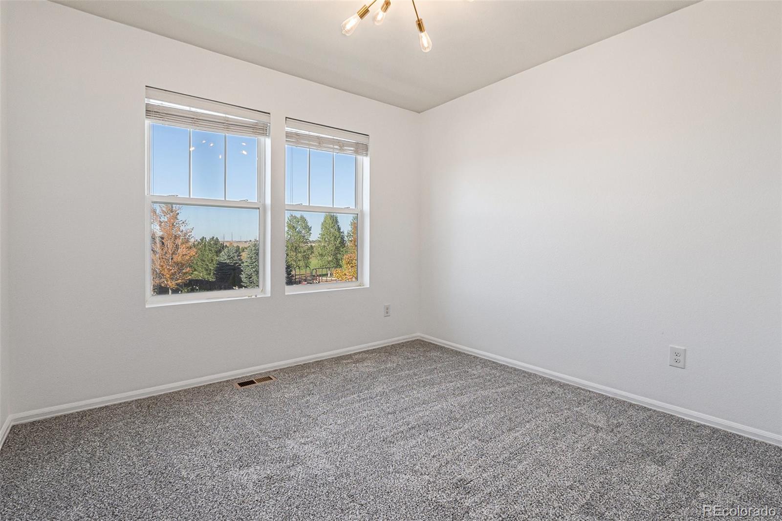 25970 East 3rd Avenue Aurora, CO 80018 - Photo 16 of 26 an empty room with a window