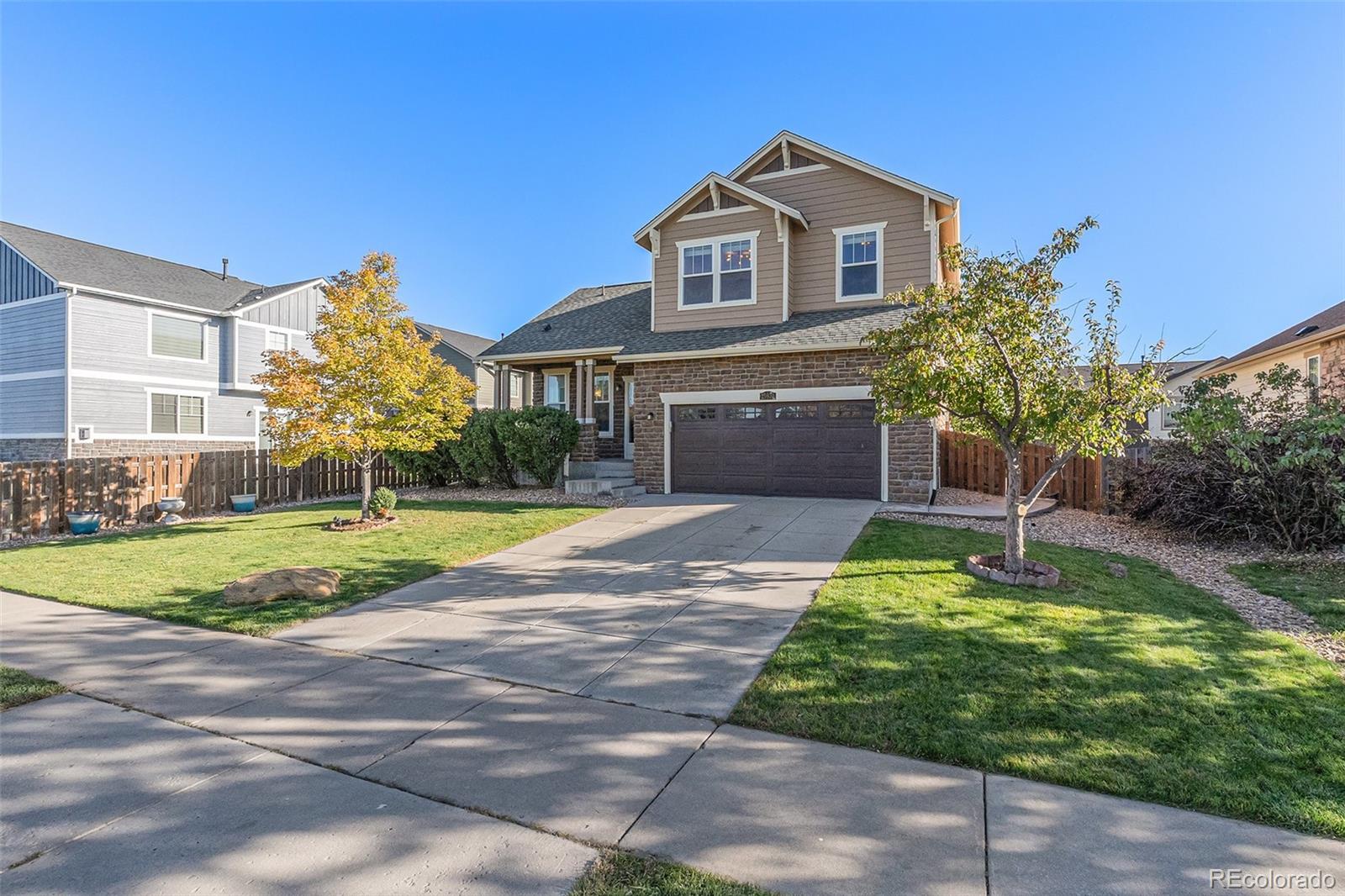 25970 East 3rd Avenue Aurora, CO 80018 - Photo 2 of 26 a front view of a house with a yard