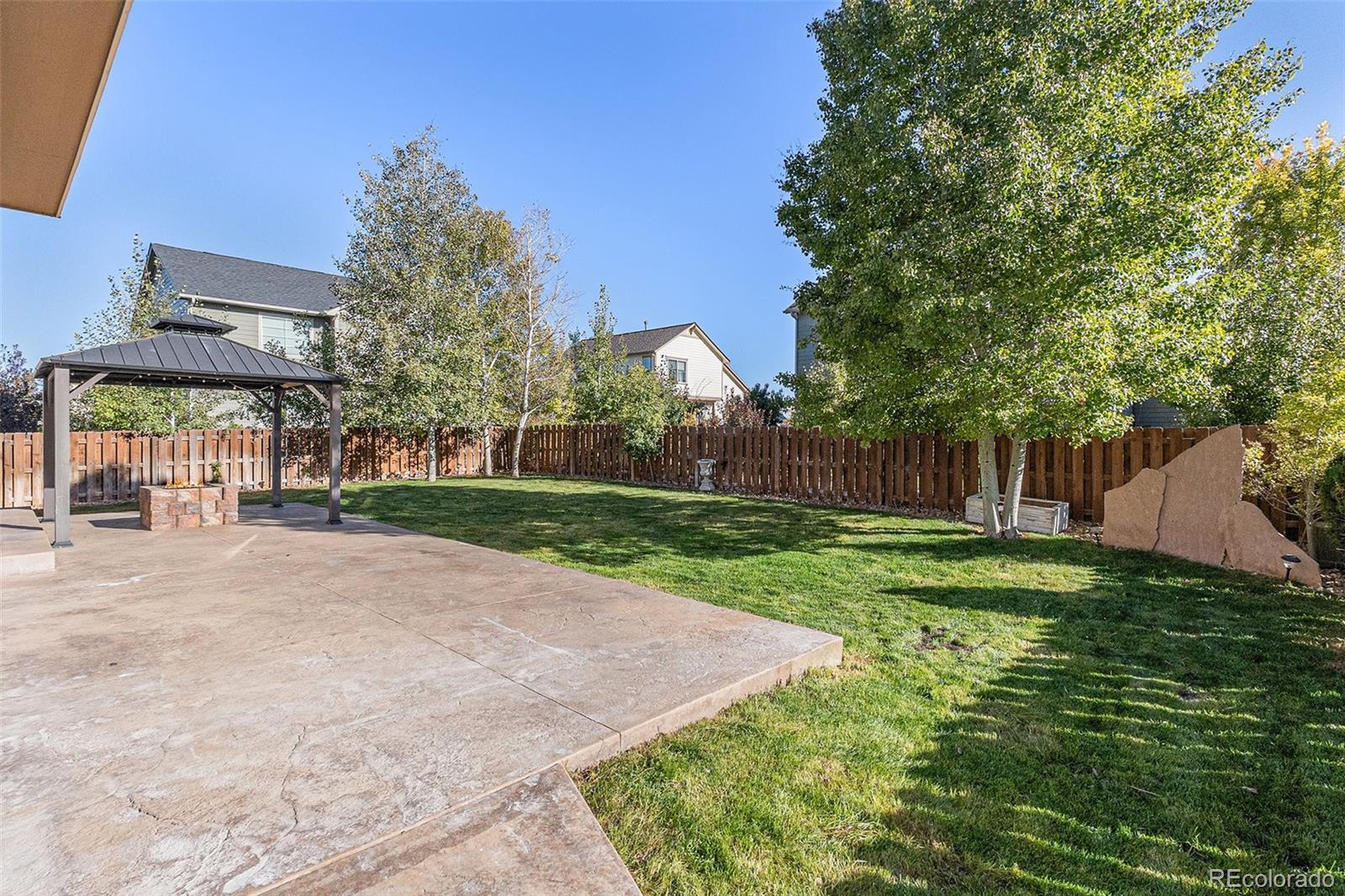 25970 East 3rd Avenue Aurora, CO 80018 - Photo 21 of 26 a view of a house with a yard
