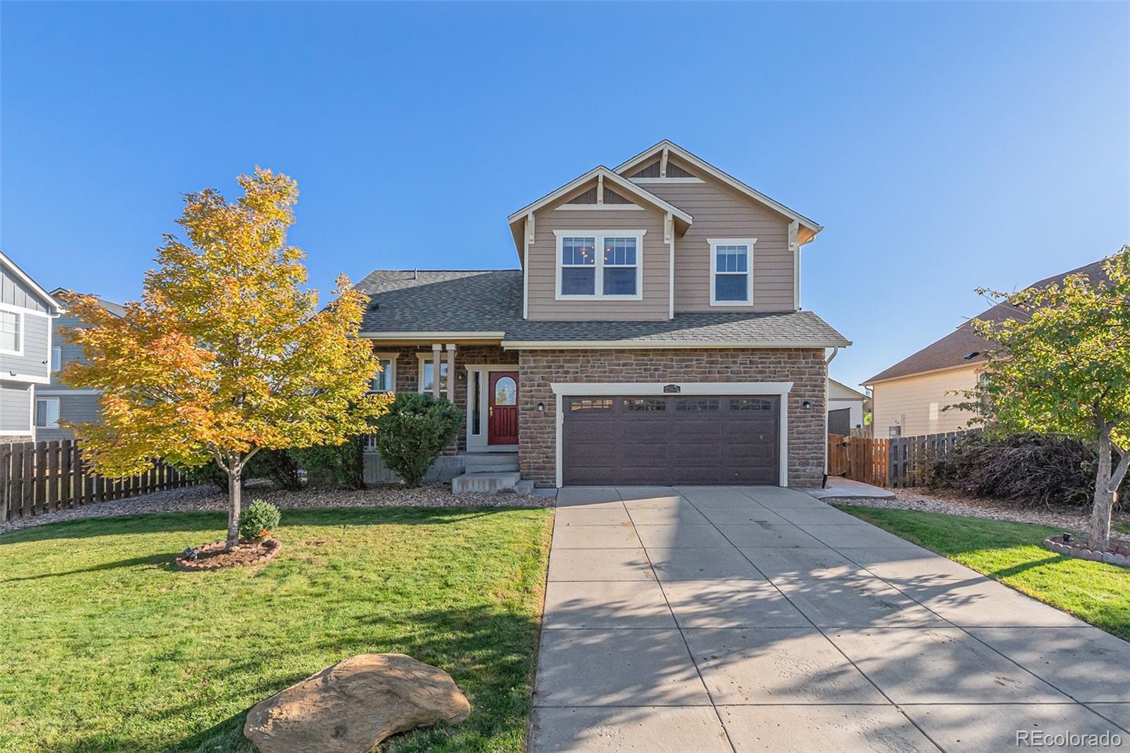 25970 East 3rd Avenue Aurora, CO 80018 - Photo 23 of 26 a front view of a house with garden