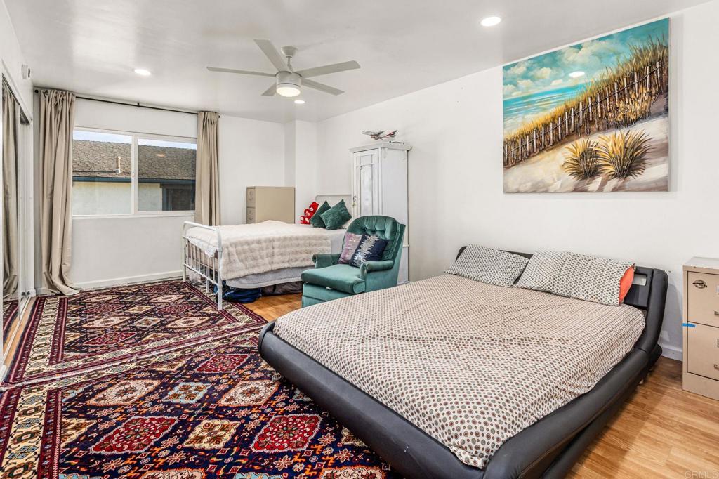 3446 Los Mochis Way Oceanside, CA 92056 - Photo 12 of 17 a bedroom with two beds and a large window
