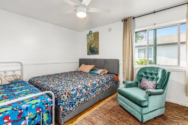 a bedroom with bed and a window
