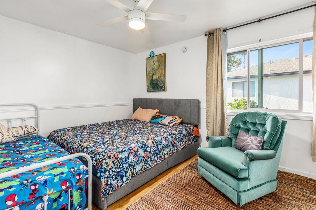 3446 Los Mochis Way Oceanside, CA 92056 - Photo 15 of 17 a bedroom with bed and a window