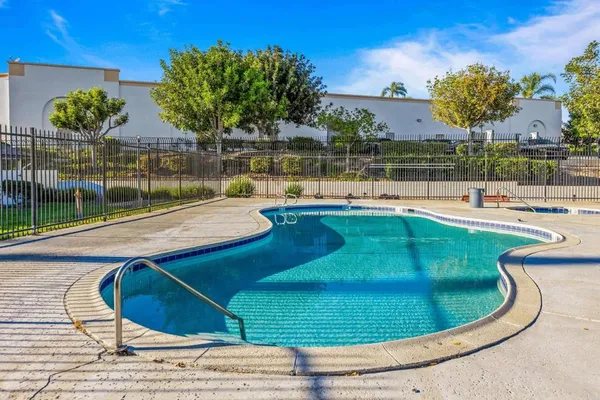 a view of a swimming pool with a patio