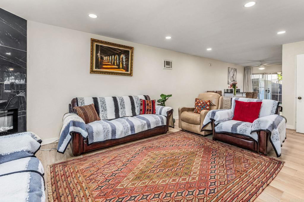 3446 Los Mochis Way Oceanside, CA 92056 - Photo 4 of 17 a bedroom with a bed and couch