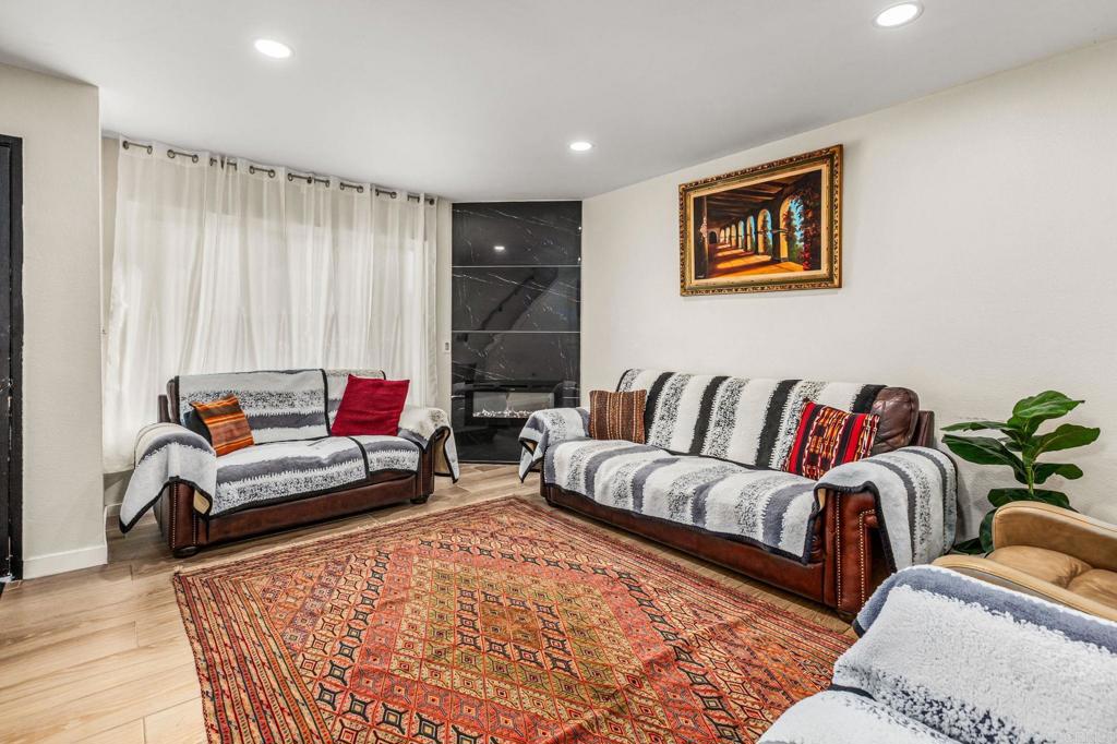 3446 Los Mochis Way Oceanside, CA 92056 - Photo 5 of 17 a living room with furniture and a couch