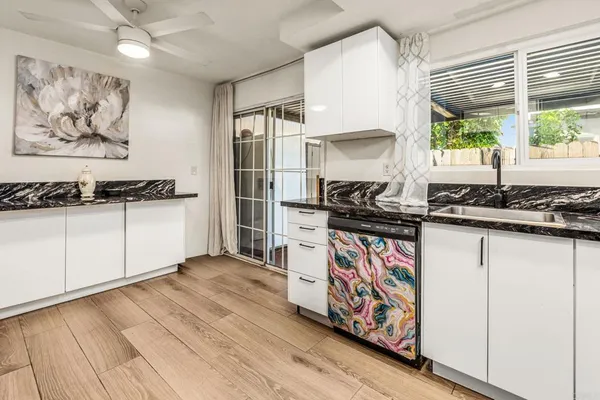 a kitchen with stainless steel appliances granite countertop a stove and a sink