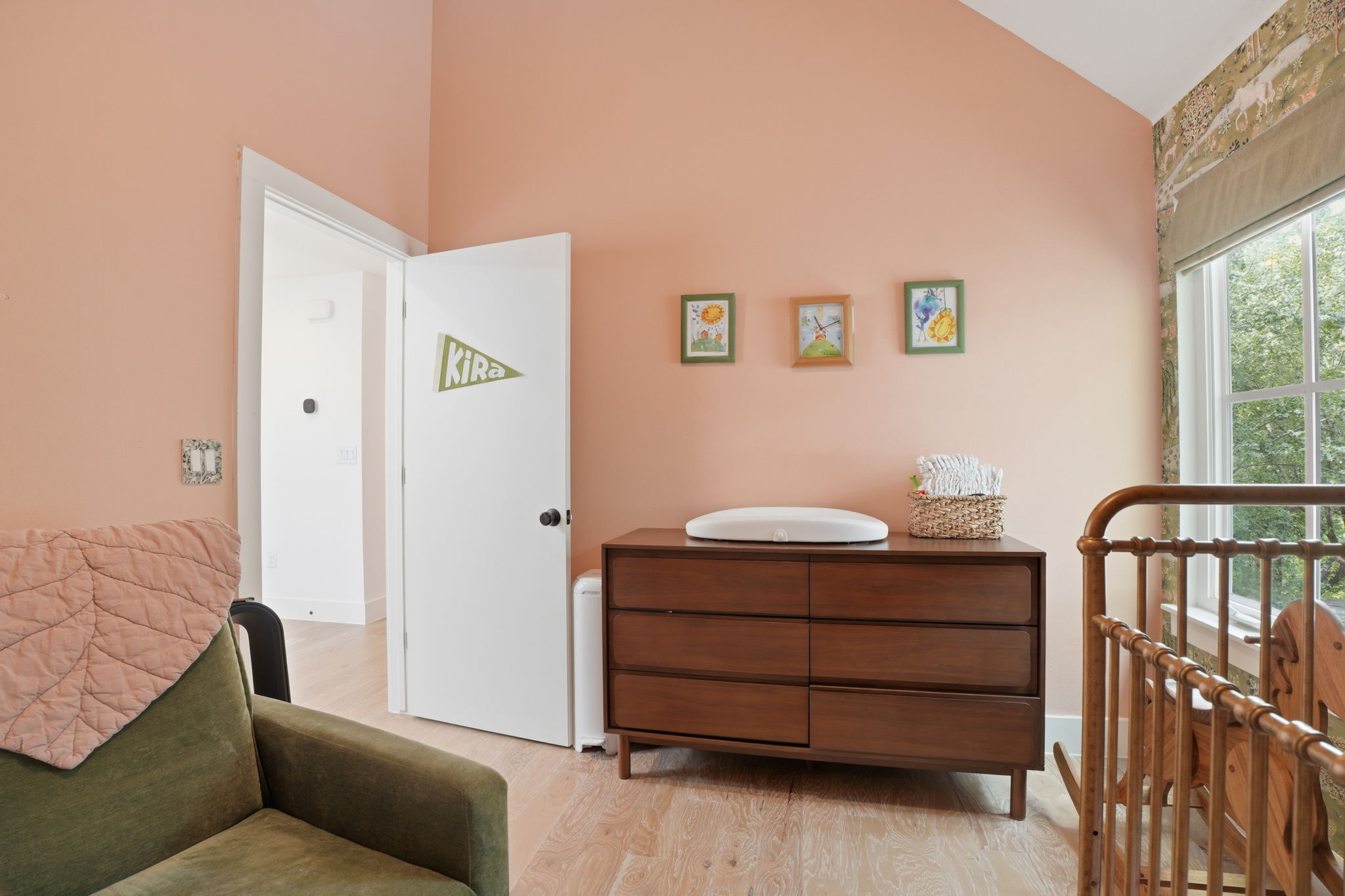 4609 Sara Drive, Unit B Austin, TX 78721 - Photo 26 of 39 A charming bedroom currently serving as a nursery with vaulted ceilings features hardwood flooring and an inviting window view.