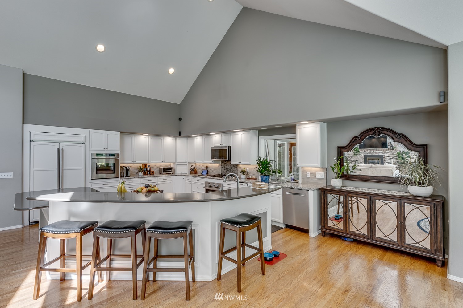13819 3rd Drive Southeast Everett, WA 98208 - Photo 11 of 39 a kitchen with stainless steel appliances kitchen island a table and chairs in it