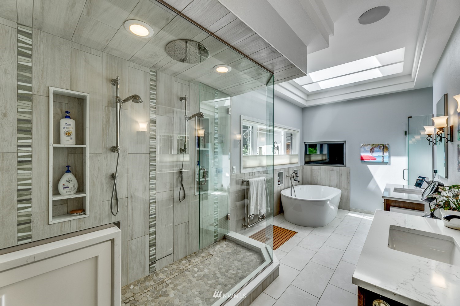 13819 3rd Drive Southeast Everett, WA 98208 - Photo 22 of 39 a spacious bathroom with a double vanity sink a toilet a mirror and shower