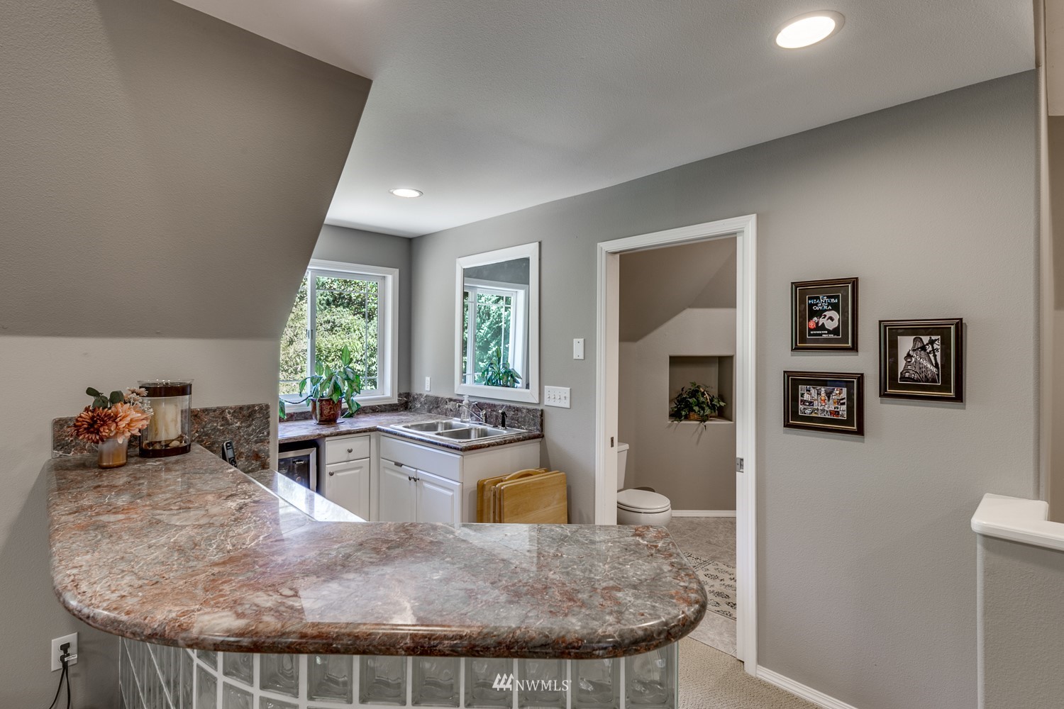 13819 3rd Drive Southeast Everett, WA 98208 - Photo 31 of 39 a kitchen with granite countertop a stove a refrigerator a sink a dining table and chairs