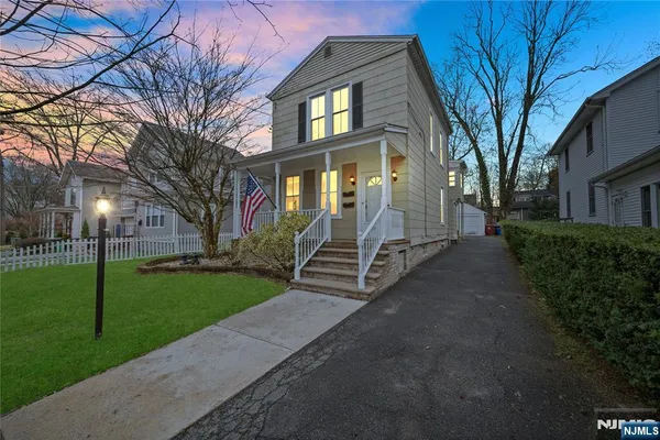 a view of a brick house with a yard