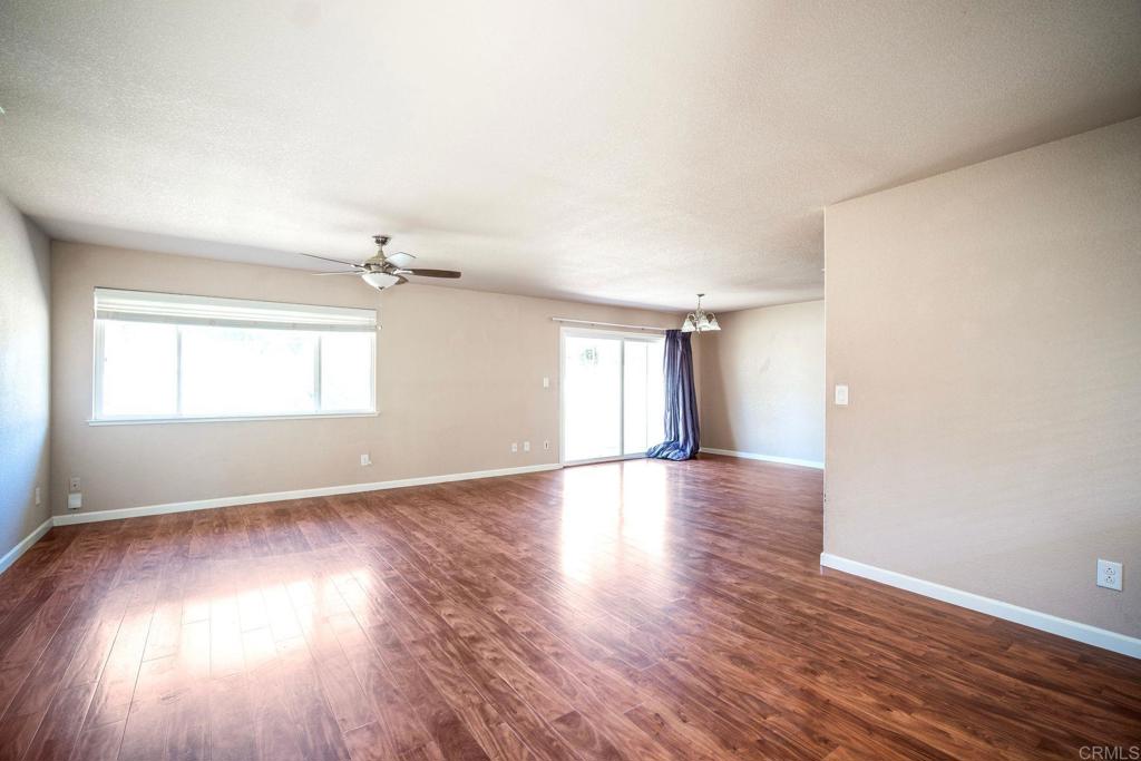 4990 Del Road Loomis, CA 95650 - Photo 18 of 22 an empty room with wooden floor and windows