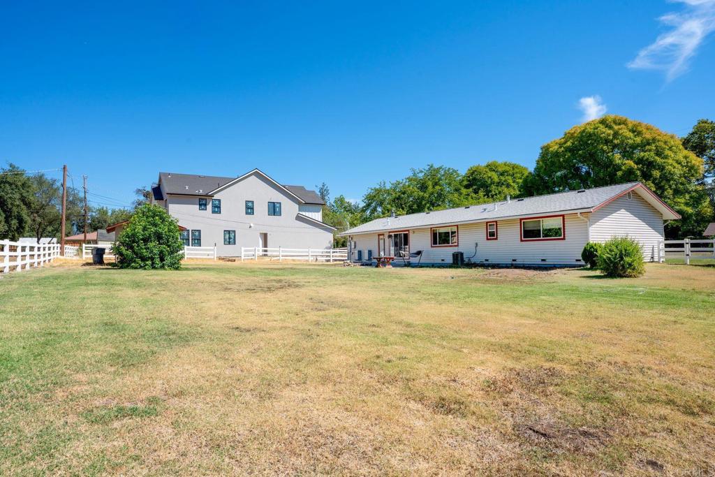 4990 Del Road Loomis, CA 95650 - Photo 20 of 22 a front view of house with yard and trees in the background