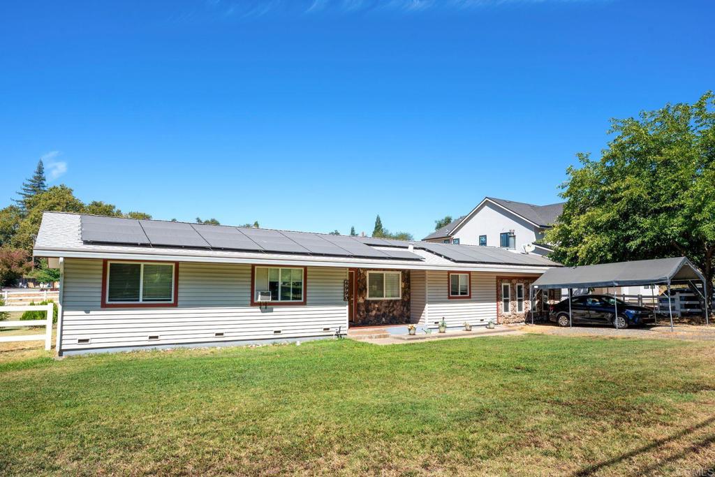4990 Del Road Loomis, CA 95650 - Photo 2 of 22 a front view of a house with garden