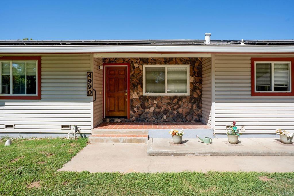 4990 Del Road Loomis, CA 95650 - Photo 5 of 22 a front view of a house with a yard