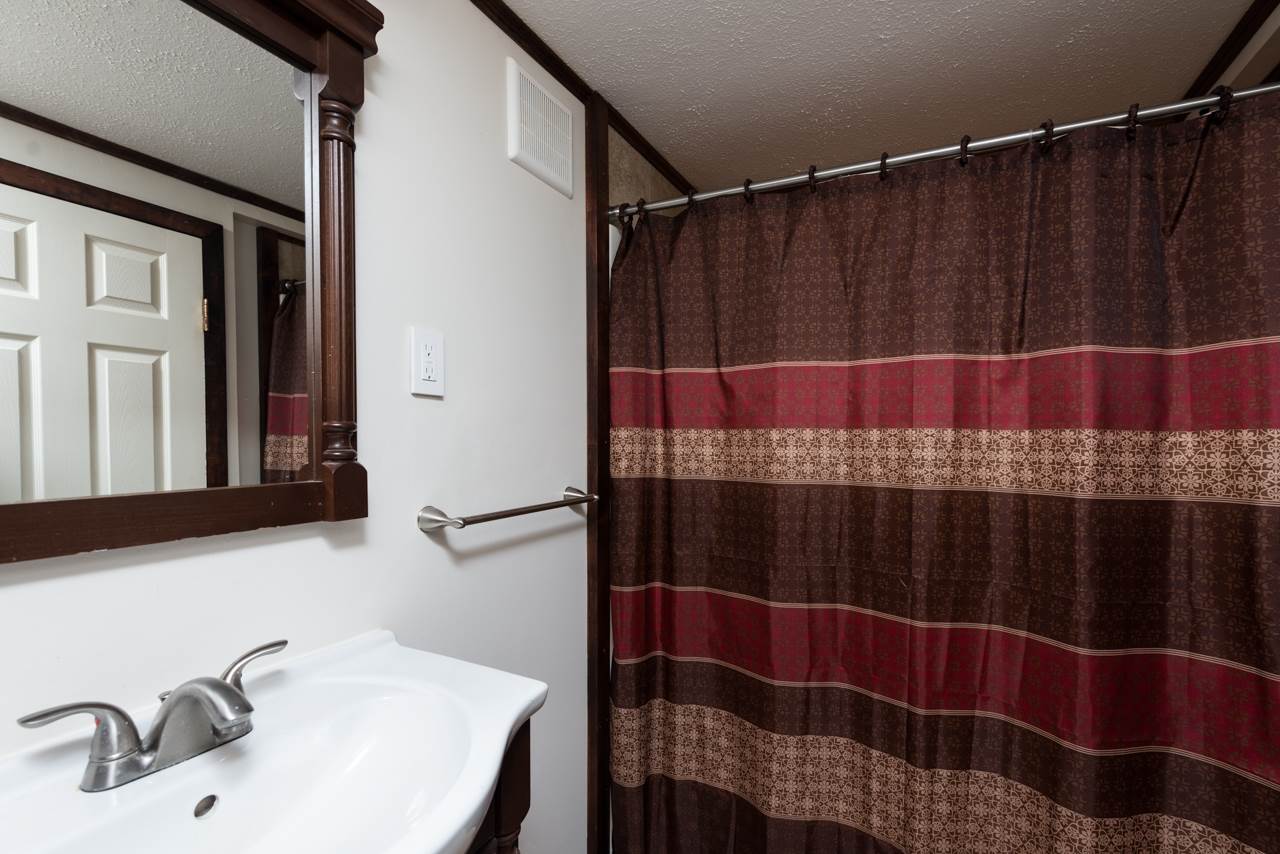 10572 Cook Town Road Bridgewater, VA 22812 - Photo 11 of 24 a bathroom with a sink and a mirror