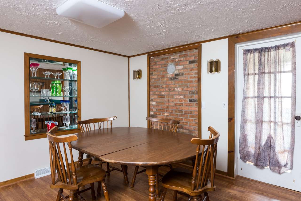 10572 Cook Town Road Bridgewater, VA 22812 - Photo 6 of 24 a view of a dining room with furniture and wooden floor