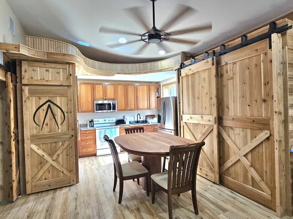 a view of a dining room with furniture window and wooden floor