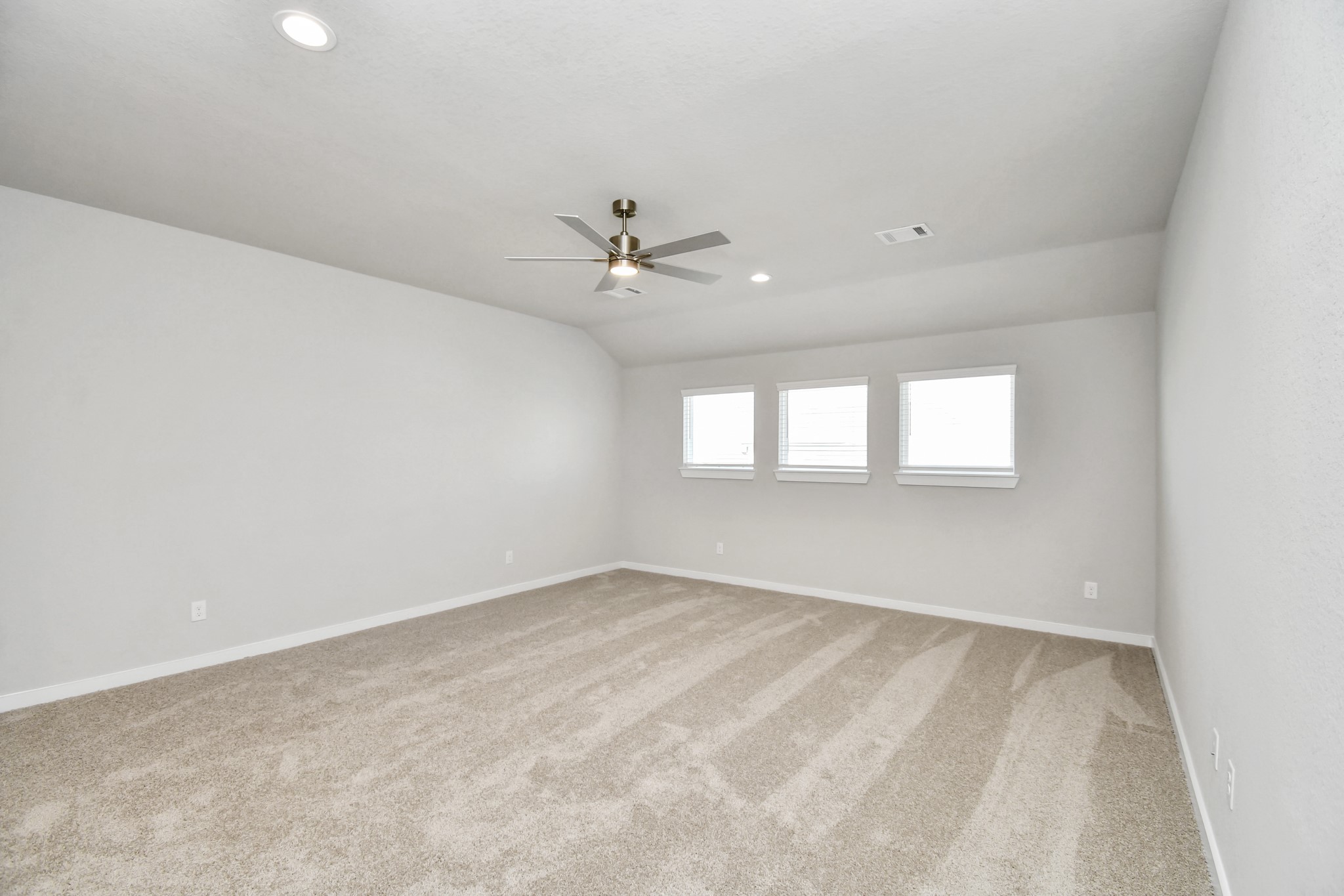 3106 Native Spg Drive Spring, TX 77373 - Photo 28 of 38 Come upstairs and relish a day of relaxation in this loft area! Ideal as an additional living space or game room, it boasts plush carpeting, high ceilings, custom paint, and windows that flood the area with abundant natural light. Sample photo of completed home with similar floor plan. Actual colors and selections may vary.