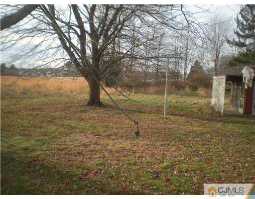220 Gordon Road Old Bridge, NJ 07747 - Photo 9 of 9 a view of a yard with large trees